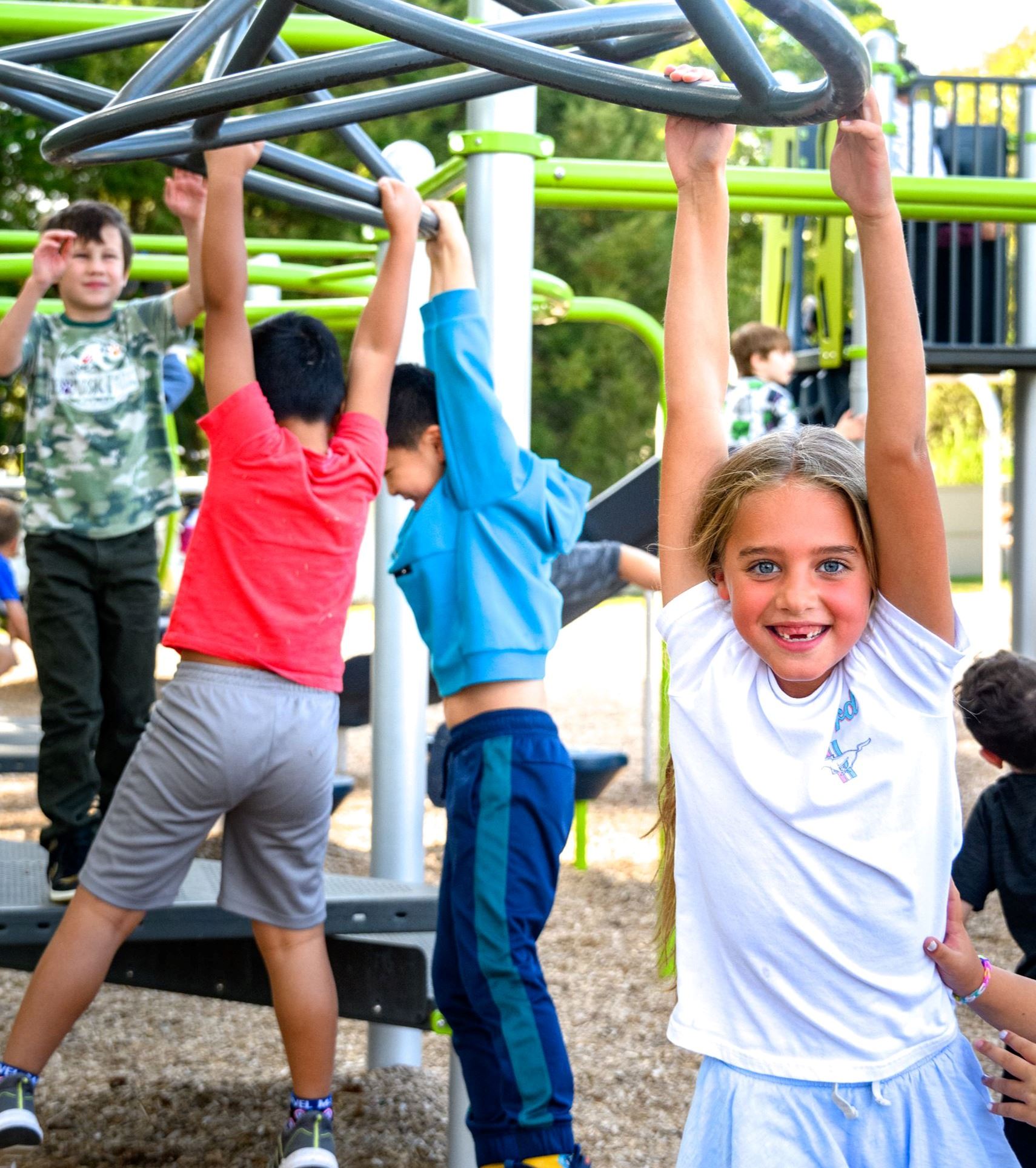 Children playing on playground playset at Mansfield Elementary